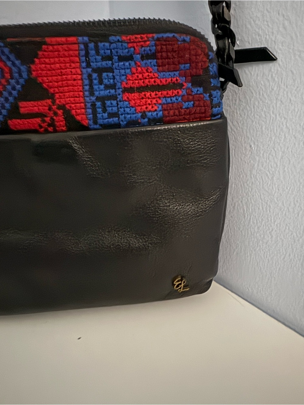 Elliot Luca Black Leather Crossbody Bag with Red & Blue Woven Detail